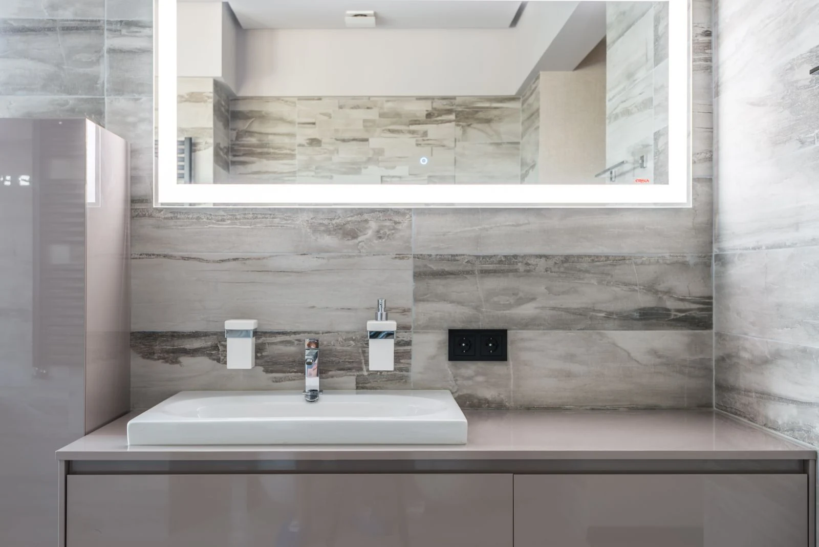 Grey bathroom vanity and mirror